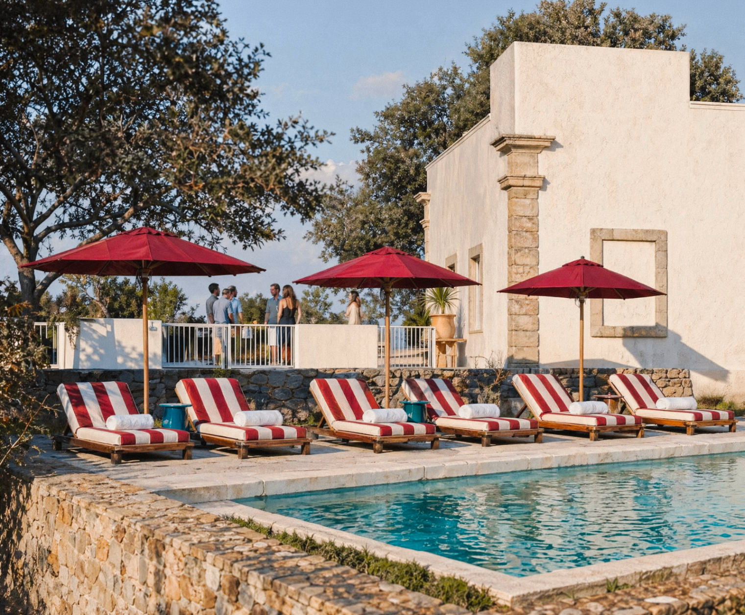 Villa Riluci pool with sunbeds and umbrellas
